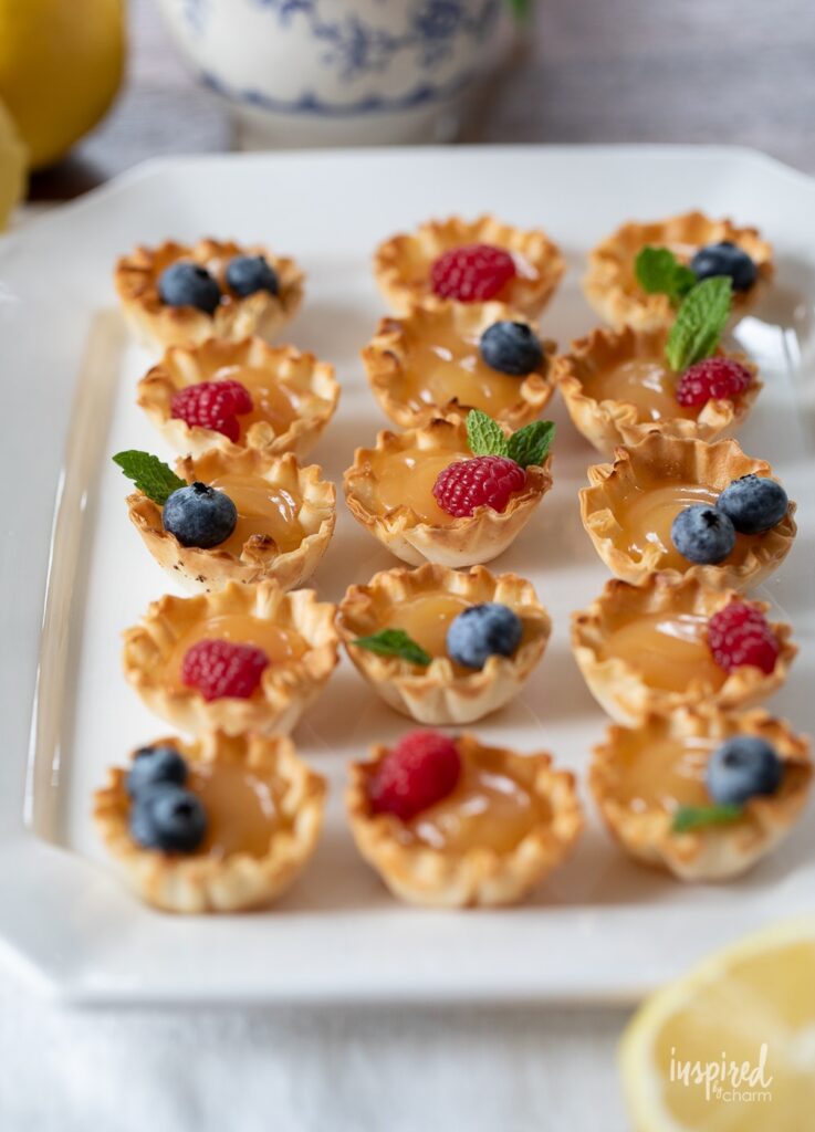 This image has an empty alt attribute; its file name is easy-lemon-curd-tartlets-recipe-737x1024.jpg