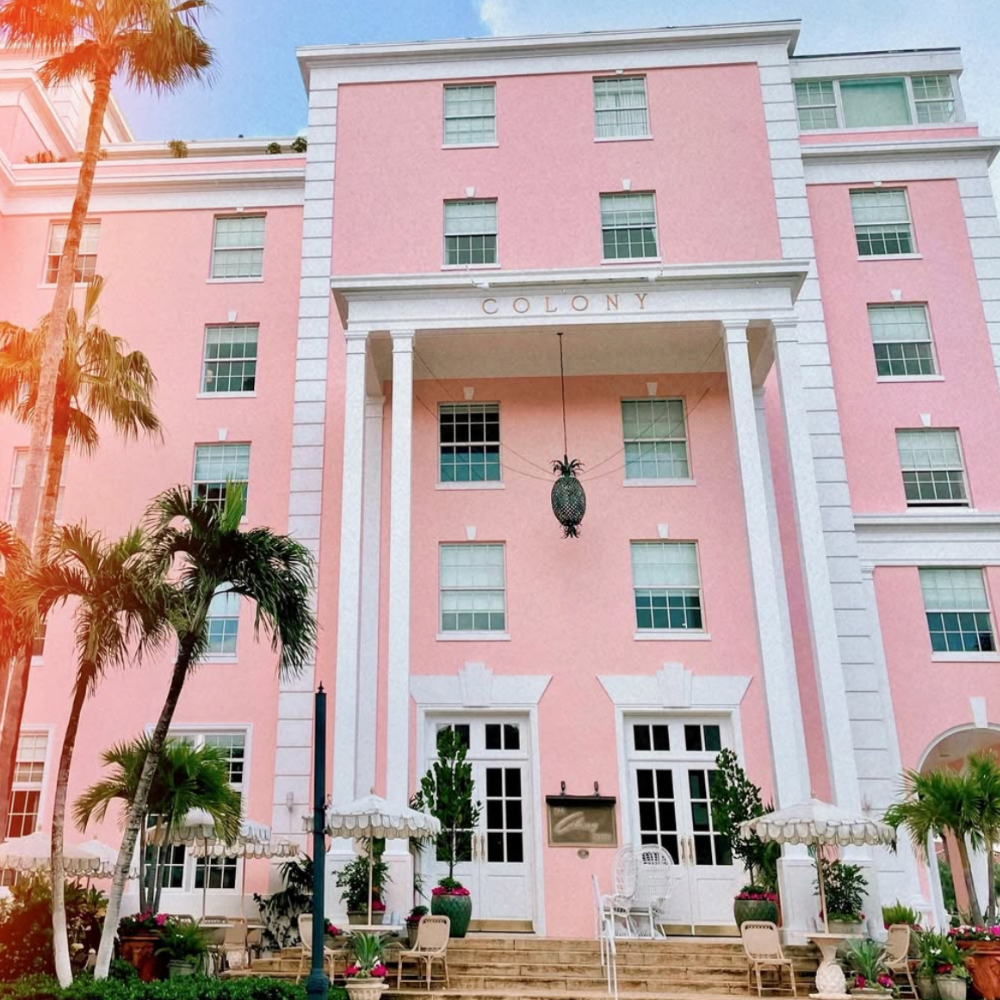 The Colony Hotel Palm Beach iconic pink exterior with palm trees near Worth Avenue