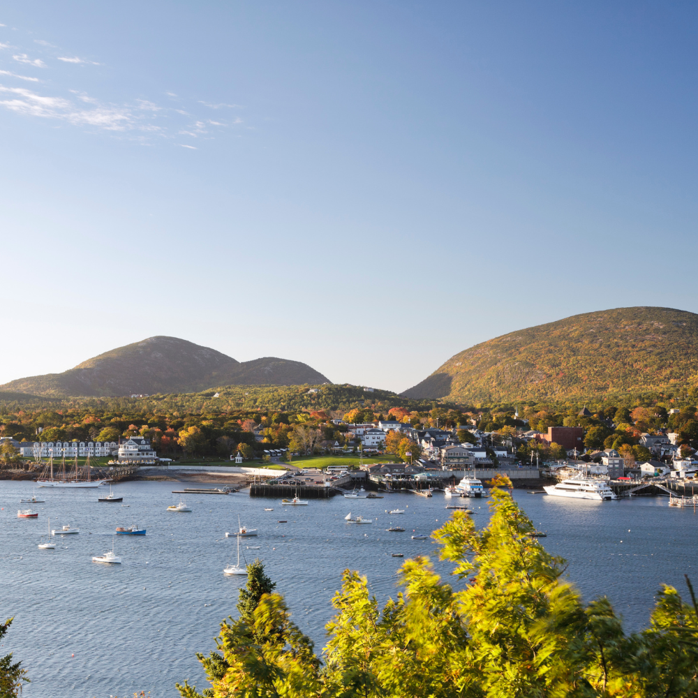 Scenic view of Bar Harbor, Maine, overlooking Frenchman Bay with boats in the harbor and the charming downtown.